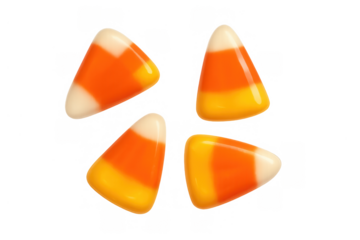 Candy corn pieces isolated with a transparent background, showing traditional colors of yellow, orange, and white