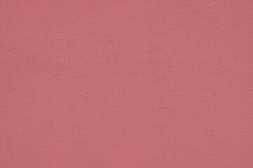 Close-up of pink concrete plastered wall.