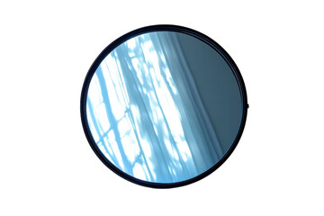 Round mirror reflecting sunlight and window curtains creating abstract patterns on transparent background