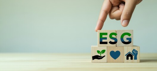 ESG Concept Illustration: A hand carefully positions wooden blocks spelling ESG, a visual representation of environmental, social, and governance principles, with corresponding icons.