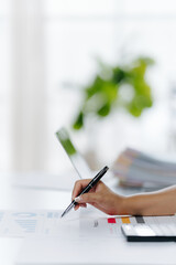Penning Precision: A close-up shot of a hand meticulously writing with a pen on paper, signifying thoughtful analysis and deliberate documentation.