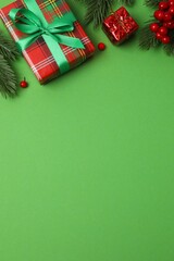 Bright festive vertical scene with wrapped gifts and decorations on a green background, Christmas and New Year holiday