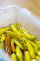 Close-Up of Pickled Peppers in a Glass Jar
