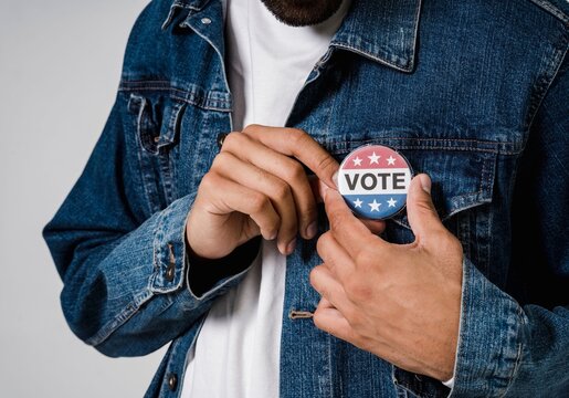 man holding a Election Vote stemp