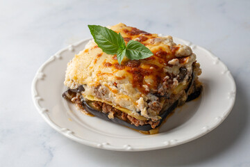 Traditional Greek potato and meat casserole with cheese - moussaka