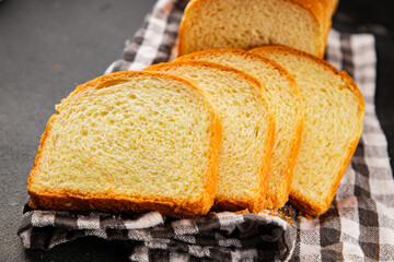 Brioche bread slices bakery pastry natural product tasty snack fresh delicious gourmet food background on the table rustic top view copy space