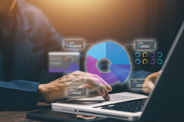 A businessman analyzing digital charts and pie graphs on a laptop, representing data analytics, business intelligence, and performance visualization for corporate decision-making.