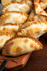 Baked Creole empanadas made with homemade dough filled with meat, ham and cheese, vegetables, Roquefort cheese, bacon, egg, olives, vegan and vegetarian. 