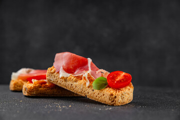 jamon bruschetta prosciutto appetizer portioned tapas dish natural tasty snack fresh delicious gourmet food background on the table rustic top view copy space