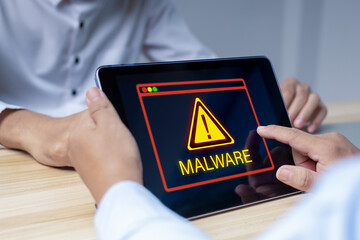 Virus. people hand work on digital mobile smart tablet with virtual malware attack warning graphic, antivirus protection software, cybersecurity, business finance, internet network technology concept