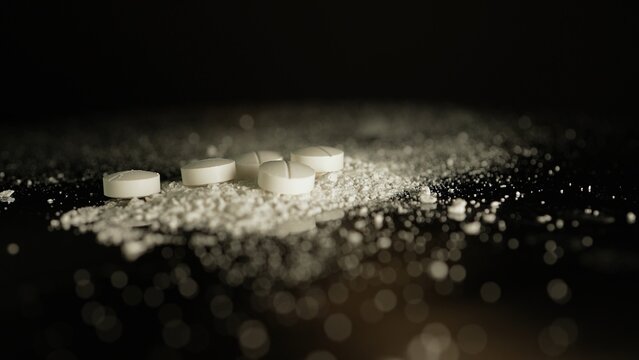 White crystalline powder made of crushed oxycodone prescription medications pills. Powdered drugs. Extreme macro close up of hand made Illegal narcotic substance.