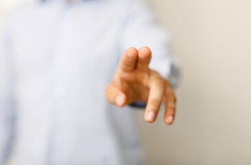 Close up of a hand pointing or touching an invisible screen, perfect for concepts like touch, press, and futuristic interfaces.