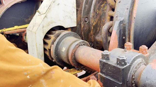 Bosun operates windlass and lifts anchor &mdash; real footage of full anchor heaving process on cargo ship. The anchor chain moves through the guides and drops into the chain locker.