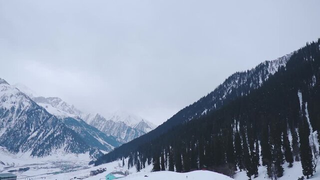 Snow covered mountains of Sonamarg, Jammu and Kashmir, India. Winter landscape. Stunning natural beauty with snow-capped mountains and glaciers. Travel and holidays concept.