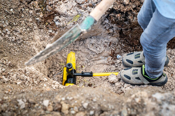 A valve and line Pipe Gas-Stop connector located on an underground pipeline. This type of equipment is typically used at control points on natural gas, water, or other pressurized lines.