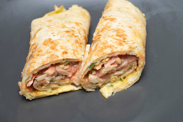 Double egg roll shawarma wraps , packed with vibrant fresh ingredients and a luscious creamy sauce. Perfect for a quick, satisfying meal anytime.