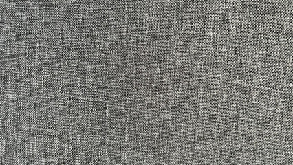 Textured gray fabric background showcasing intricate weave patterns, ideal for design projects, textile applications, and creative presentations with copy space