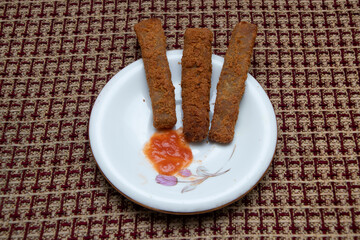 Crispy chicken fingers paired with a zesty tomato sauce. This delicious appetizer is ideal for casual dining, family gatherings, and appealing menu additions.
