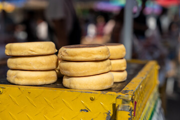 Gorditas de Nata, Mexican style clotted cream biscuits in street market, tianguis, gorditas de nata stand at the flea market. 