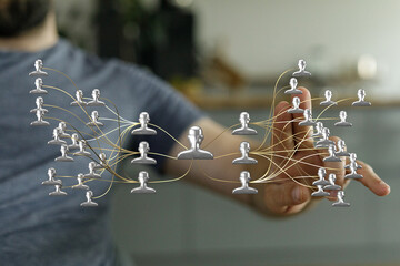 Concept of teamwork and communication visualized with a digital network, social connection and data transfer by a human hand, representing globa