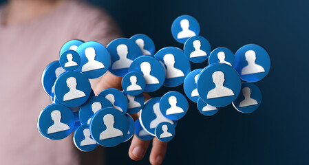 Abstract image showing a hand holding person icons representing social connections, networks and...