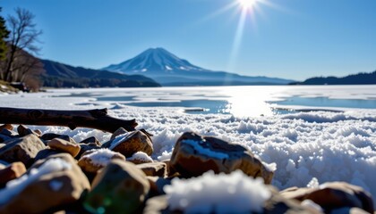 A mesmerizing winter scene captured from an extreme close up perspective, where the viewer's gaze is drawn upward from the icy, textured surface of a frozen lake's edge