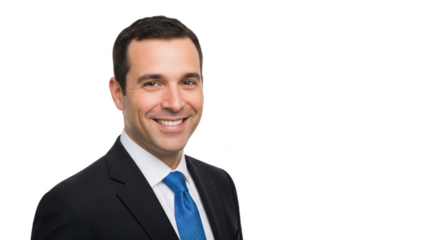 A professional headshot of a smiling man in a suit, against transparent background