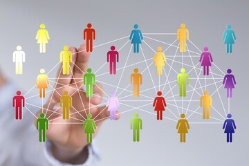 Concept of social network and global communication, hand touching connected icons, representing people, teamwork, and business.