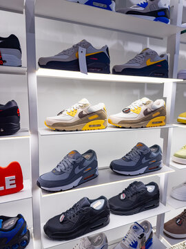 Bratislava, Slovakia, 9 June 2025: Nike Air Max sneakers display in fashion store. Selection of Nike Air Max shoes on shelves with stylish lighting in retail store
