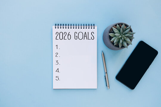 2026 goals planning concept with notebook and accessories. Concept of new year planning, goal setting, resolutions, productivity, personal development, and organization for 2026.
