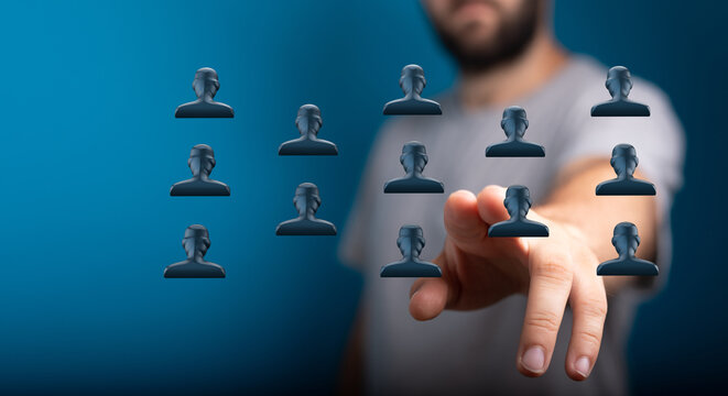 Concept of digital networking, human interaction, connections, and technology interface. A hand touches digital person icons on a blue backgroun