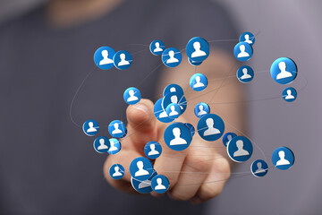 Abstract image showing network of people, digital connections, social media interaction, representing teamwork and community, touching display.