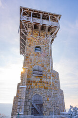 The lookout tower on Wysoki Kamien offers stunning views of the Jizera Mountains. Visitors can enjoy the scenic landscape and fresh air, making it a perfect spot for nature lovers.