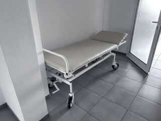 A medical gurney in the clinic lobby. A stretcher next to the medical ward