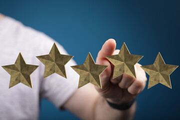 A hand pointing at five golden stars. Symbol of high rating, positive feedback and success. Perfect for business reviews and customer satisfacti