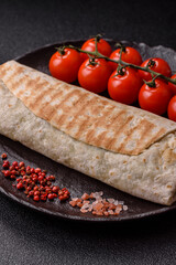 Shawarma with chicken or beef, tortilla roll, and vegetables. Shawarma with meat