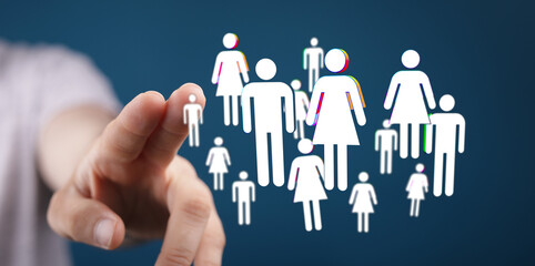 Hand pointing towards a network of human figures, representing concepts like teamwork, community,...