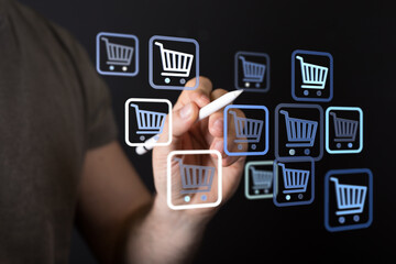 Hand interacting with digital shopping cart icons, representing online shopping and e-commerce. Concept of digital transactions and consumerism.