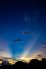sunset sky with rays of light and cloud in the evening.
