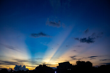 sunset sky with rays of light and cloud in the evening.