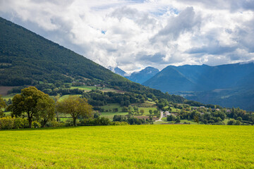 Fototapeta premium Green meadows on the road to La Salle-en-Beaumont in the Auvergne-Rhone-Alpes region, France