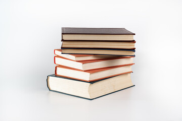 Stack of many different books isolated on white. Old books vintage top each over on white background. Collection aged book concept.