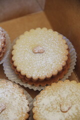 Traditional Maizena alfajores filled with dulce de leche and dusted with powdered sugar—a beloved Latin American sweet treat.