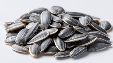 A pile of sunflower seeds, a healthy and tasty snack. The seeds are black and white, and arranged in a pile
