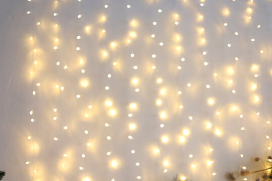 Warm white fairy lights create a cozy atmosphere during a winter evening gathering