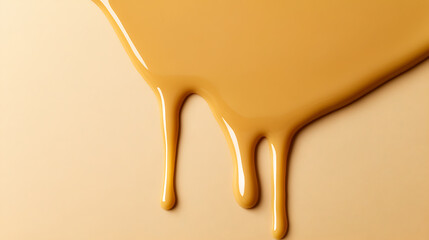 Caramel colored liquid drips diagonally downward against a matching cream background, shiny smooth texture, highlighting abstract design, light reflecting off surface.