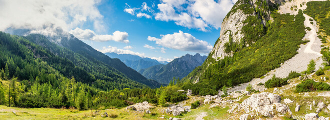 Great panoramic view of the Julian Alps with alpine landscape valleys and high rocky peaks, Slovenia.