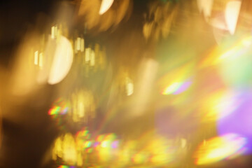 Smoke Abstract blur soft focus blinking light copy space background. Light and shadow gold rays refraction.