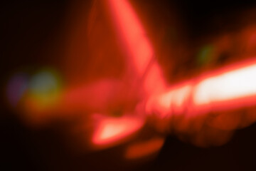 Smoke Abstract blur soft focus blinking light copy space background. Light and shadow neon red, black rays refraction.