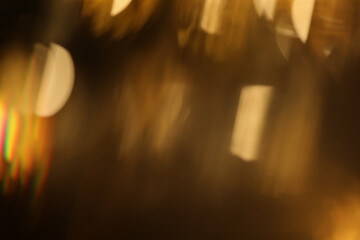 Smoke Abstract blur soft focus blinking light copy space background. Light and shadow gold rays refraction.